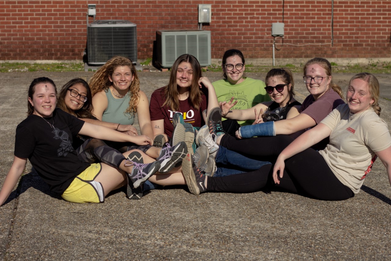 Gisel, second from left, and other supportive members on the Louisiana trip sitting together